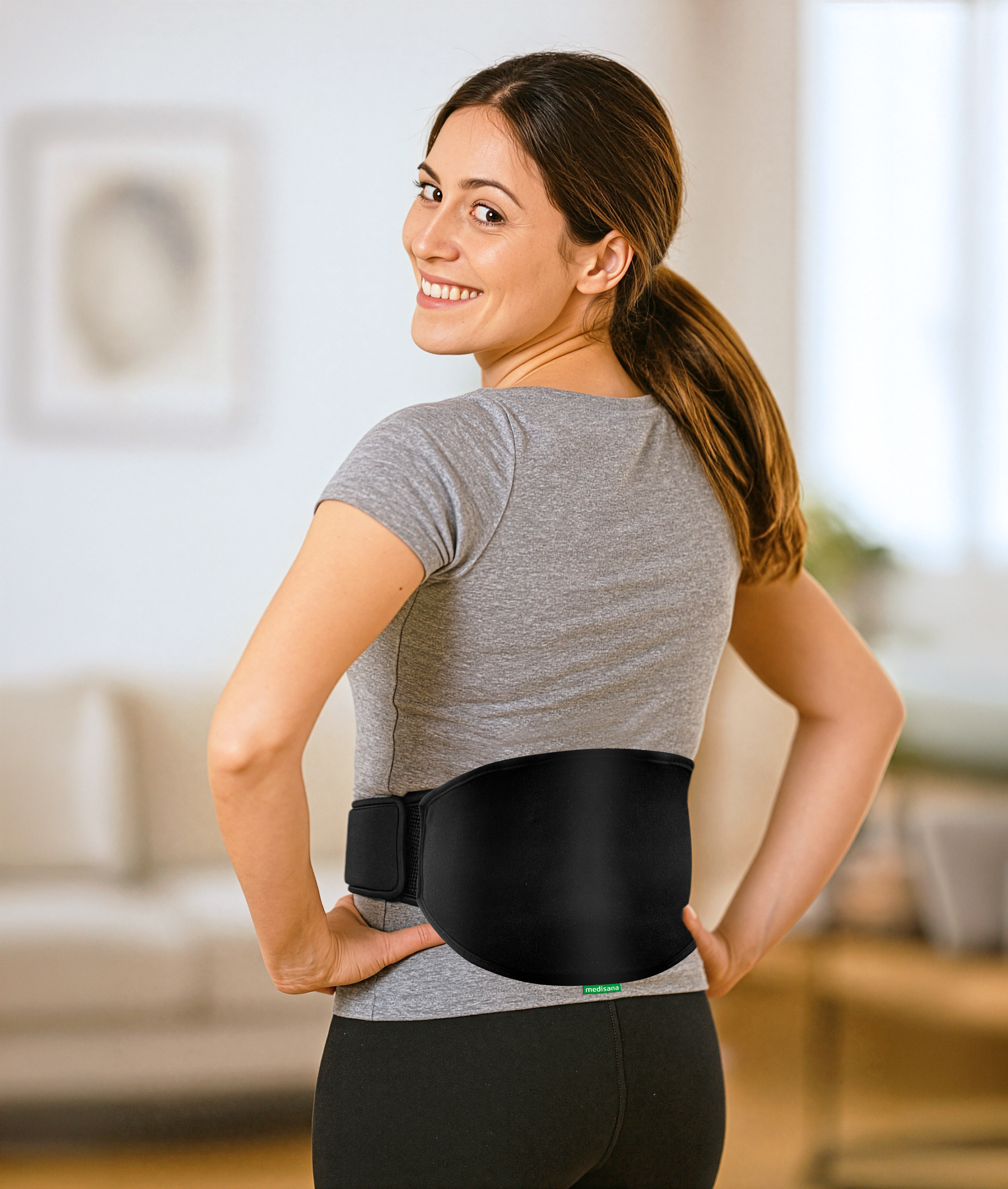 A woman wearing a medisana lower back gel pack