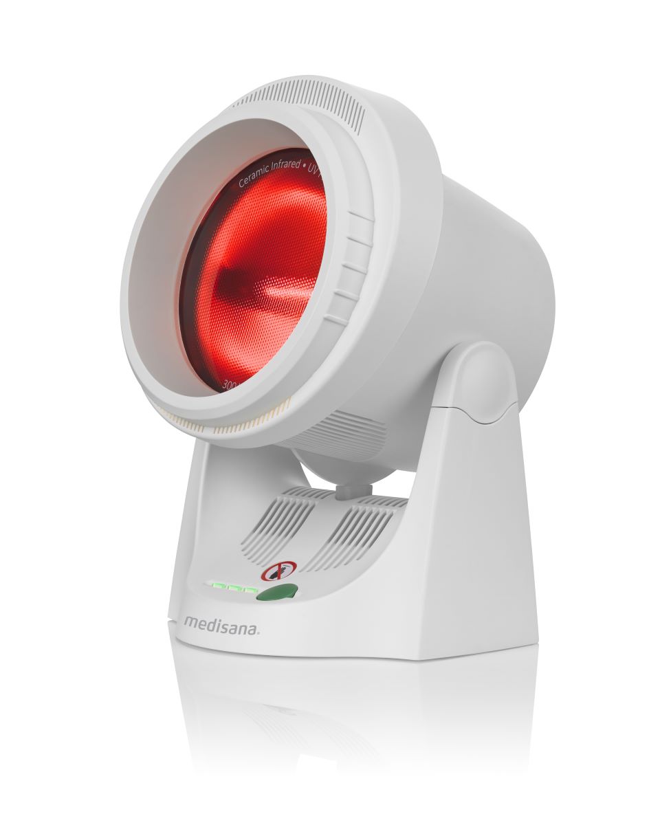 Isolated medisana infrared lamp with infrared heat switched on